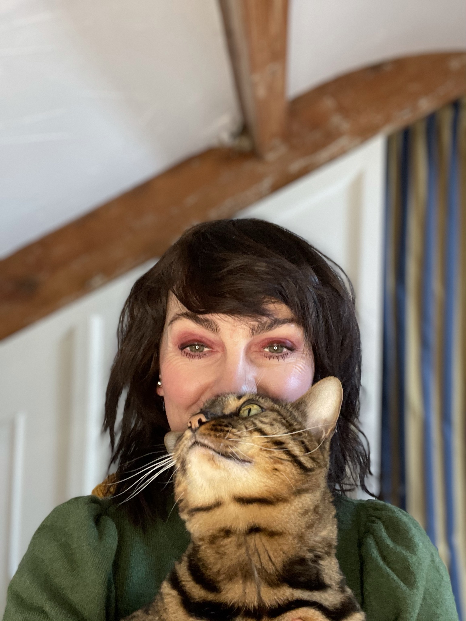 Jo Leversuch makeup artist with healthy regrown eyebrows and bengal cat